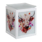 A white cube-shaped decorative electric burner with a square glass lid, featuring watercolor-style illustrations of a Highland cow with colorful flowers on the front and side panels.
